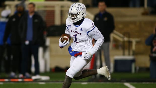 Nov 12, 2022; Lubbock, Texas, USA; Kansas Jayhawks punt returner Kenny Logan Jr. (1) returns a kick against the Texas Tech Red Raiders in the second half at Jones AT&T Stadium and Cody Campbell Field. Mandatory Credit: Michael C. Johnson-USA TODAY Sports